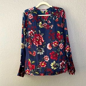 Satin feel dressy top, beautiful floral design. NEVER WORN